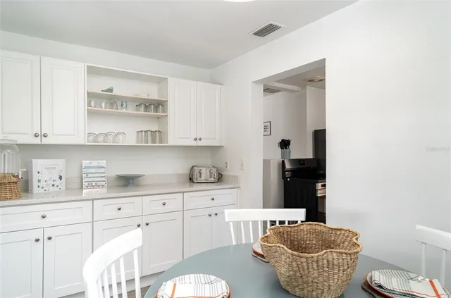 a living room with fireplace furniture and a flat screen tv