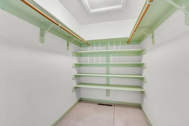 a kitchen with stainless steel appliances granite countertop a stove and a refrigerator