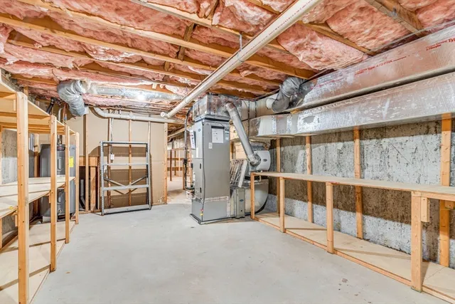 a view of swimming pool with seating space and trees in the background