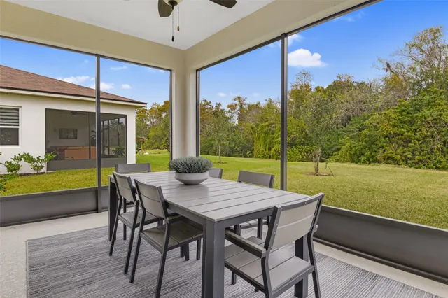 a view of a patio with a table chairs and a table