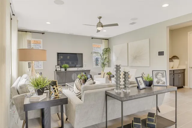 a kitchen with stainless steel appliances kitchen island table and chairs in it