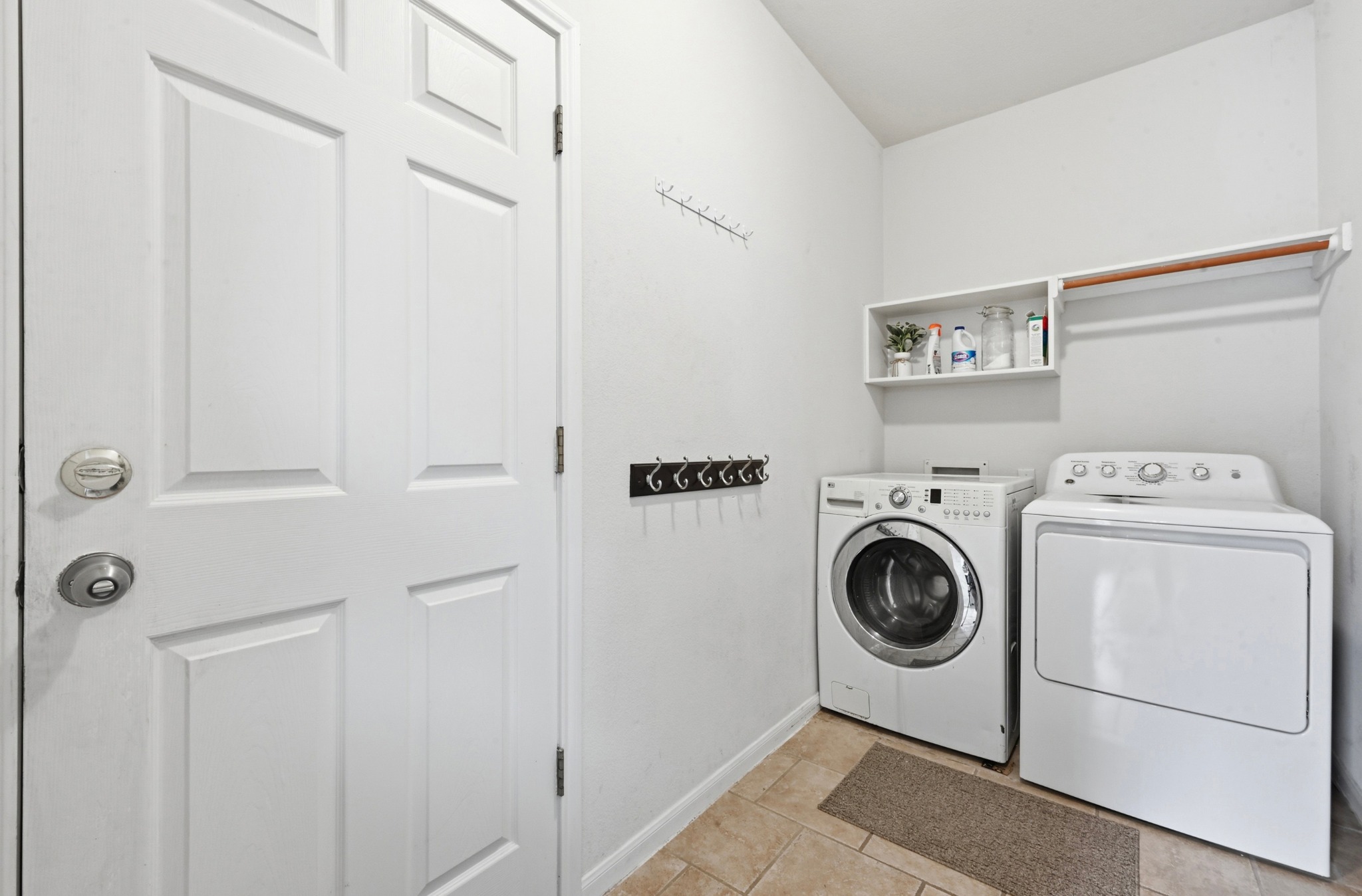 5888 Fergus Kyle, TX 78640 - Photo 27 of 40 Functional laundry space featuring modern appliances and a convenient overhead shelf for organization.