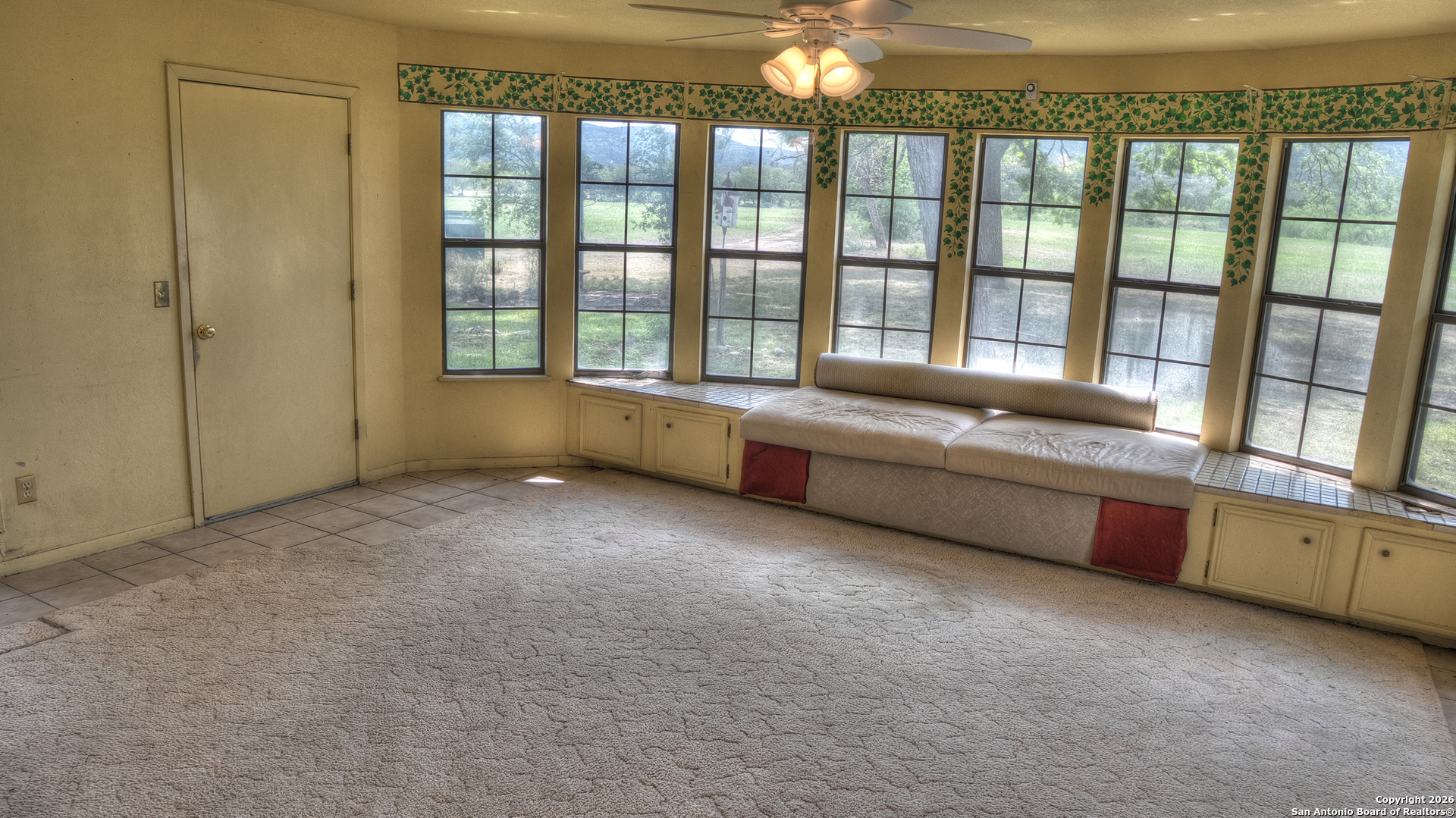 6623 Ranch Road 1120 Rio Frio, TX 78879 - Photo 11 of 25 a living room with furniture and a large window