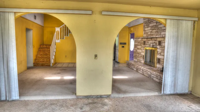 a kitchen with a sink cabinets and window