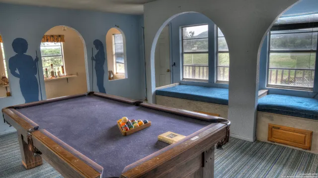 a living room with furniture and a table