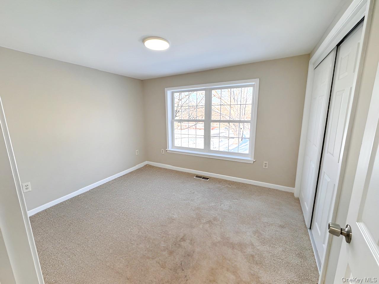 3 Glade Road Poughkeepsie, NY 12601 - Photo 11 of 19 an empty room with a window