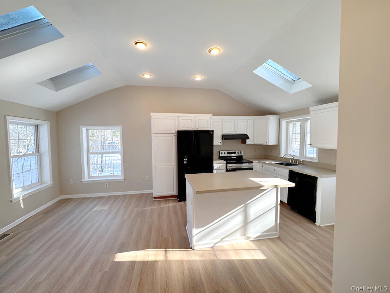 3 Glade Road Poughkeepsie, NY 12601 - Photo 6 of 19 a large white kitchen with sink and cabinets
