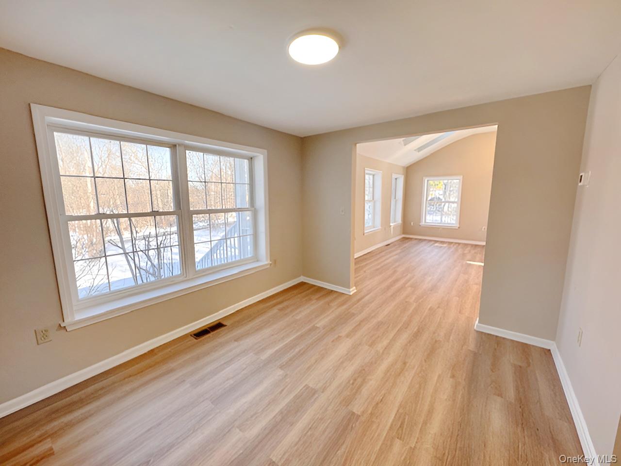 3 Glade Road Poughkeepsie, NY 12601 - Photo 9 of 19 a view of an empty room with wooden floor and a window