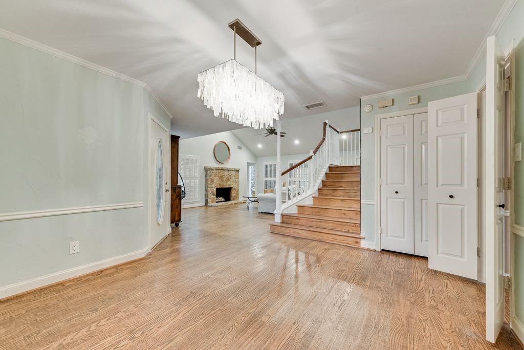 2 Eastshore Road Heath, TX 75032 - Photo 7 of 30 a view of a hallway with wooden floor and staircase
