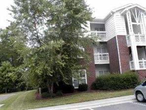 950 Jetton Street, Unit 1 Davidson, NC 28036 - Photo 1 of 8 a view of a house with a yard