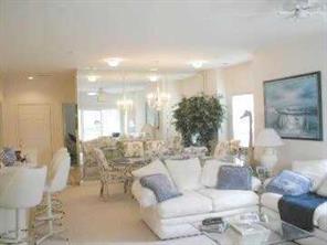 950 Jetton Street, Unit 1 Davidson, NC 28036 - Photo 3 of 8 a living room with furniture and a large window