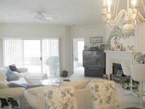 950 Jetton Street, Unit 1 Davidson, NC 28036 - Photo 4 of 8 a bedroom with a bed and a fireplace