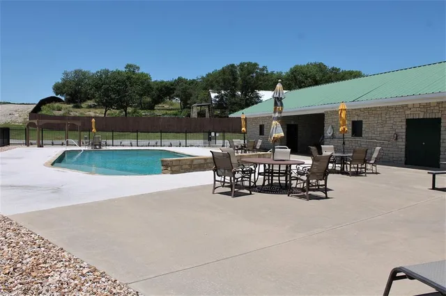 a view of a chairs and tables in the patio