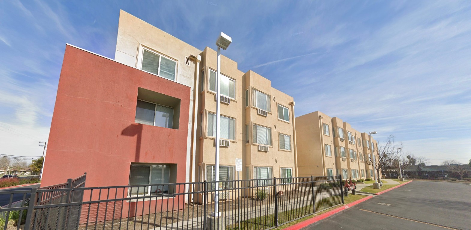 500 R Street Bakersfield, CA 93304 - Photo 5 of 6 a city street lined with tall buildings