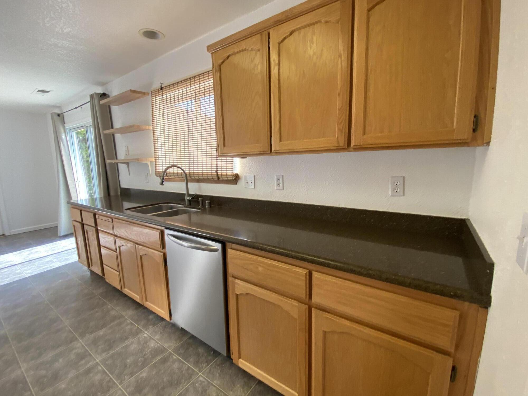 40855 Grouse Drive Three Rivers, CA 93271 - Photo 8 of 24 a kitchen with stainless steel appliances granite countertop a sink stove and cabinets