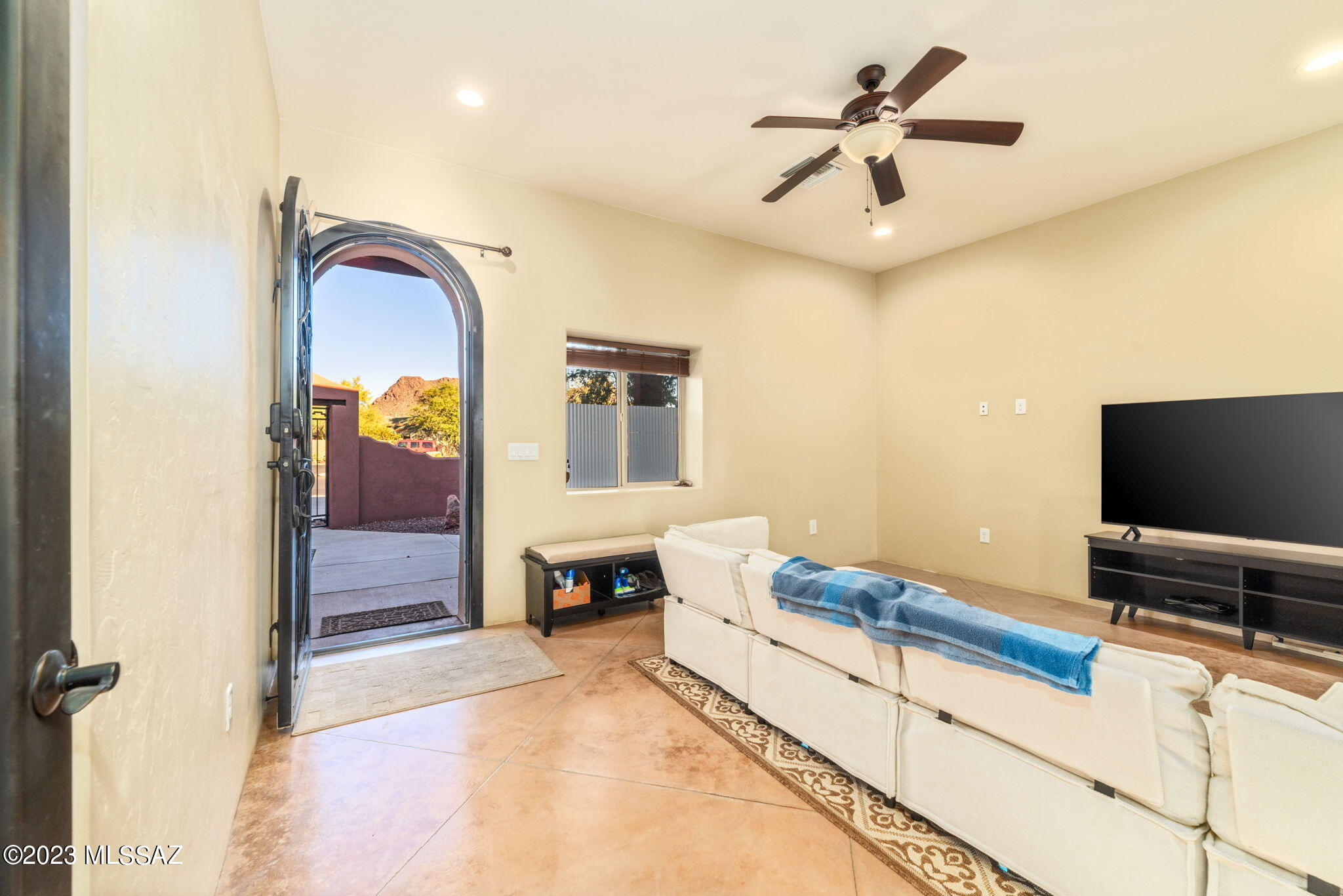 5670 Triangle X Place Tucson, AZ 85713 - Photo 25 of 36 a bedroom with a bed and a flat screen tv