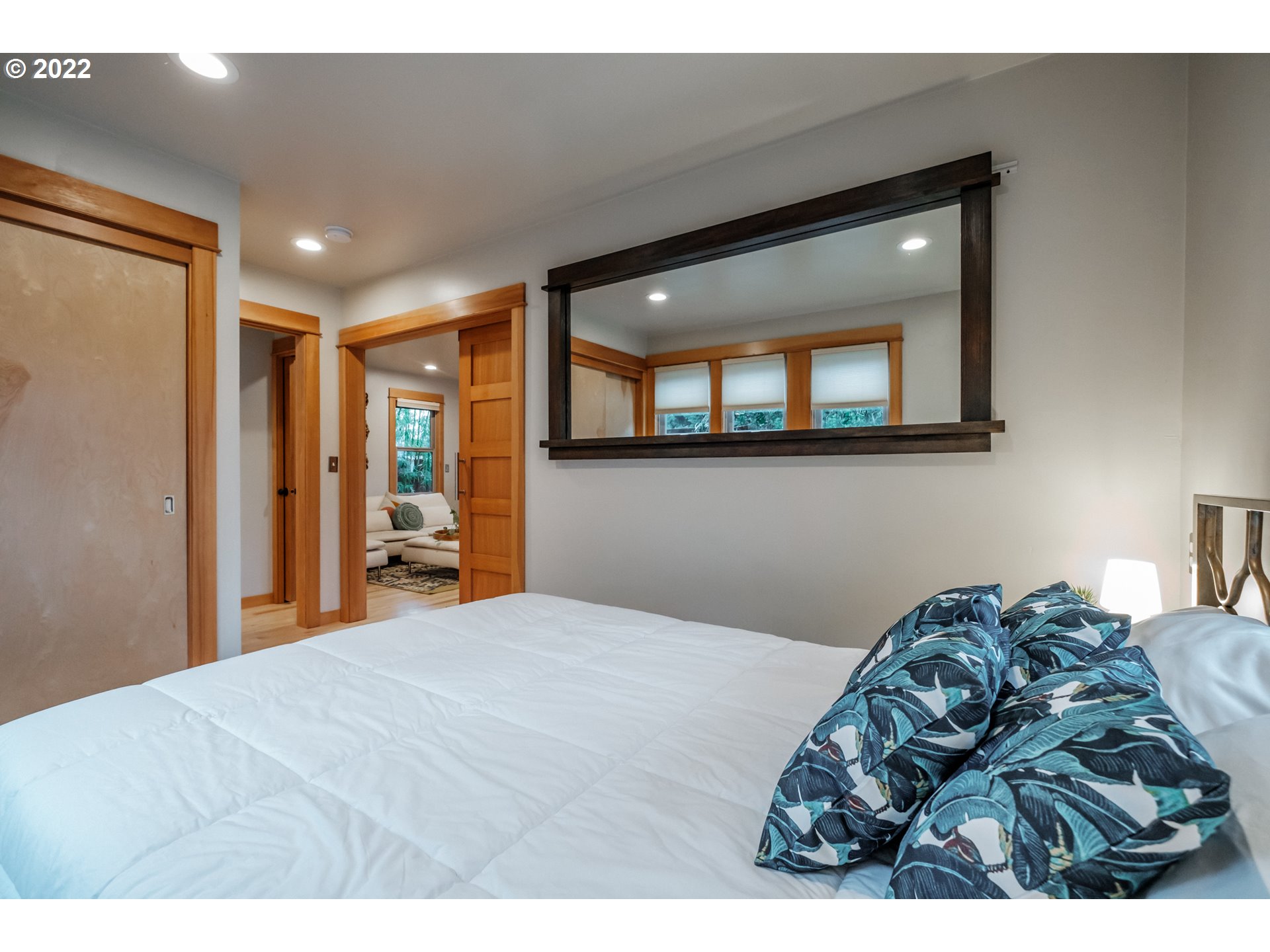 240 West F Street Springfield, OR 97477 - Photo 11 of 32 a bedroom with a bed and a large mirror
