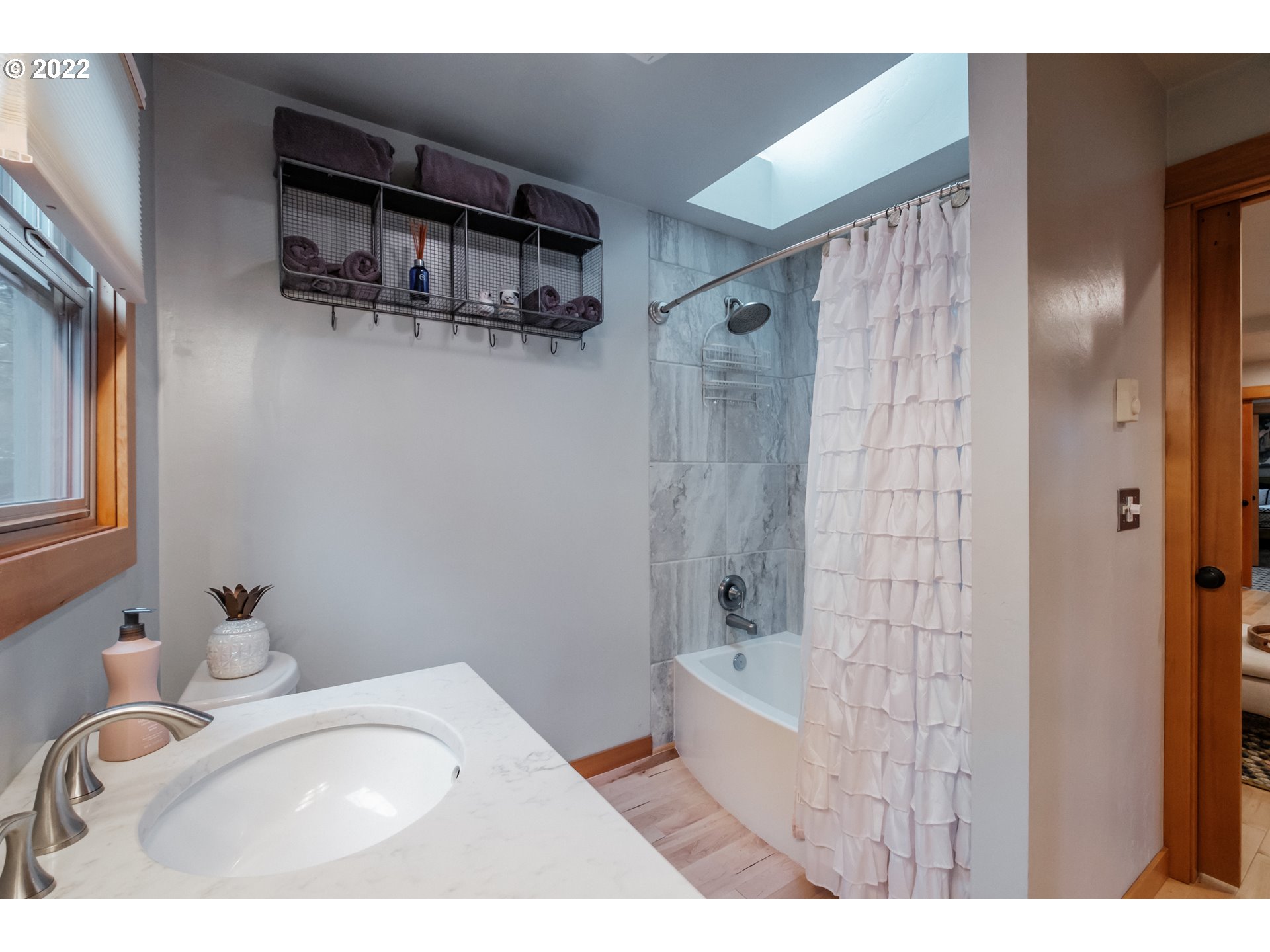 240 West F Street Springfield, OR 97477 - Photo 13 of 32 a bathroom with a sink toilet and shower