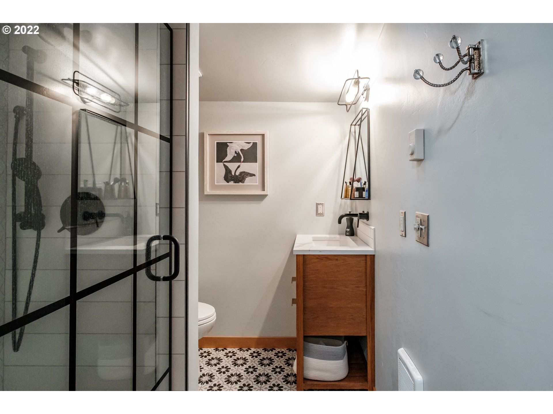 240 West F Street Springfield, OR 97477 - Photo 16 of 32 a bathroom with a sink mirror and shower