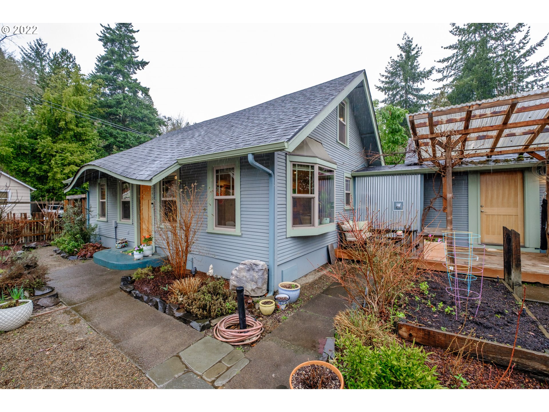 240 West F Street Springfield, OR 97477 - Photo 2 of 32 a view of a house with backyard and sitting area