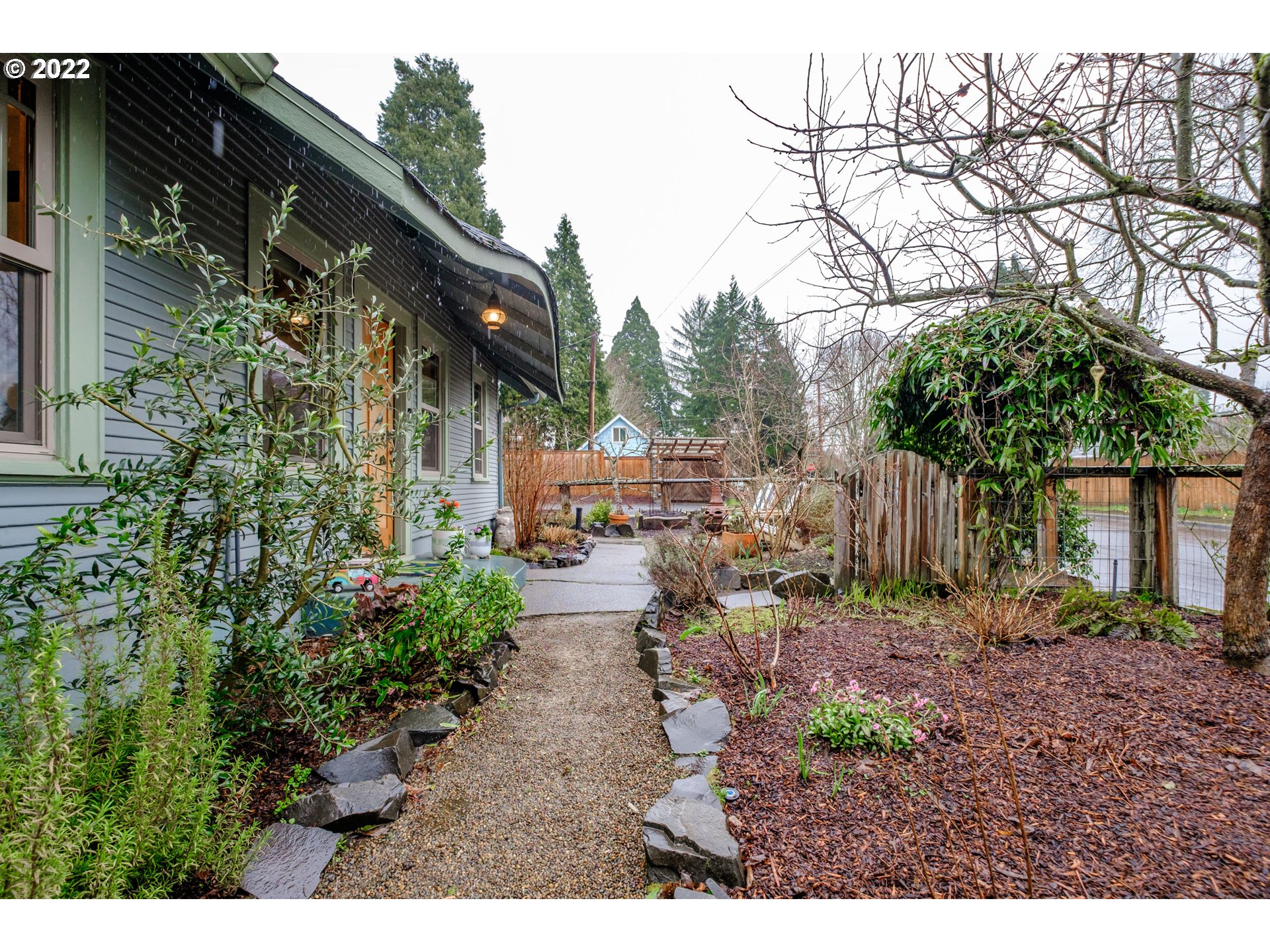 240 West F Street Springfield, OR 97477 - Photo 27 of 32 a backyard of a house with lots of green space