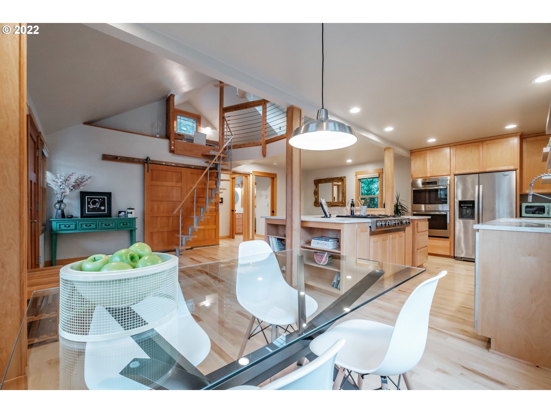 240 West F Street Springfield, OR 97477 - Photo 5 of 32 a dining room with stainless steel appliances kitchen island granite countertop a living room view