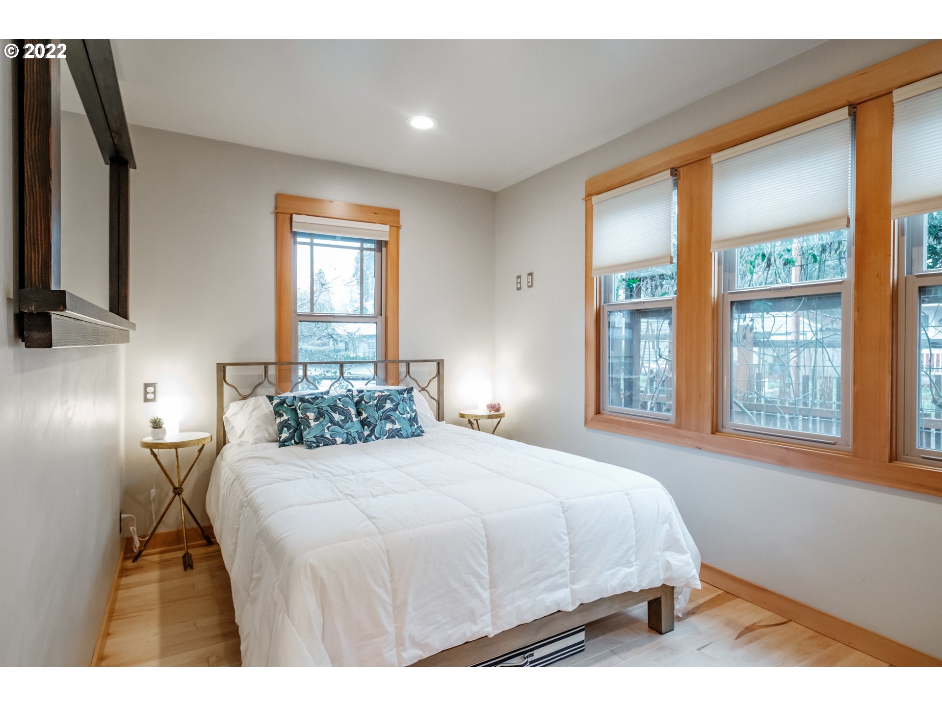 240 West F Street Springfield, OR 97477 - Photo 10 of 32 a bedroom with a bed and a large window
