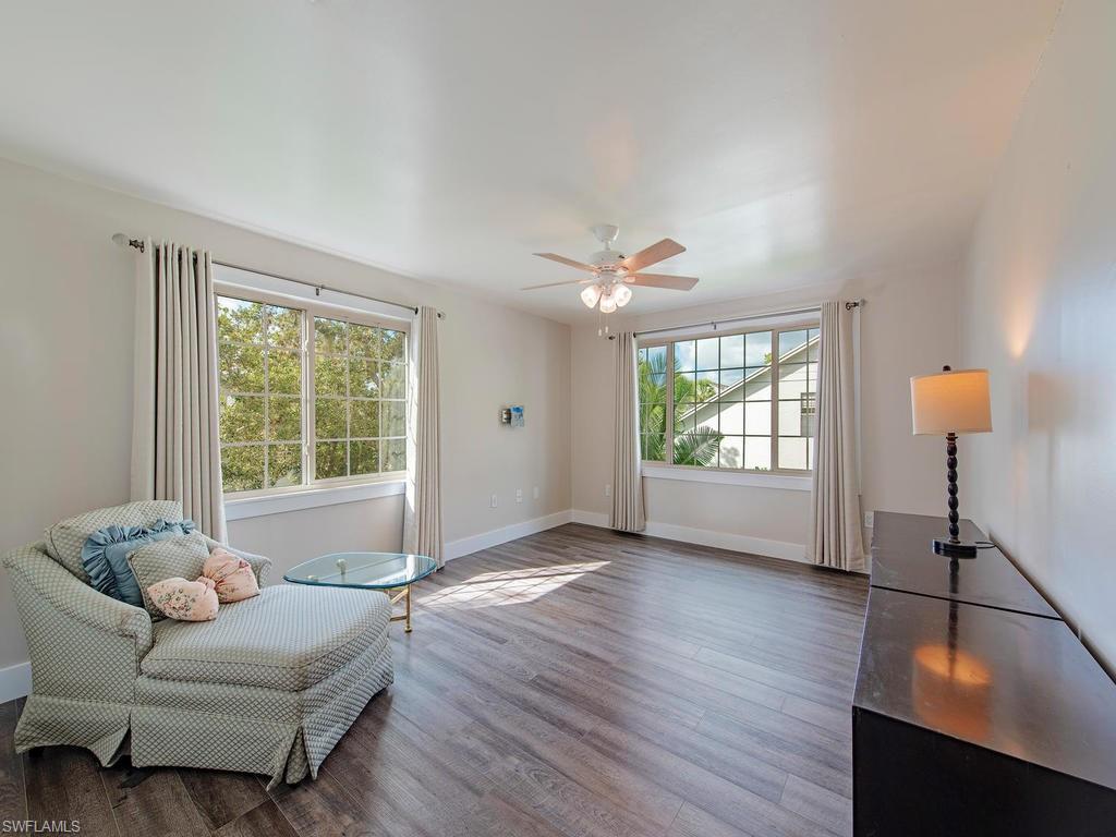 840 Meadowland Drive, Unit H Naples, FL 34108 - Photo 13 of 14 a living room with furniture and a window