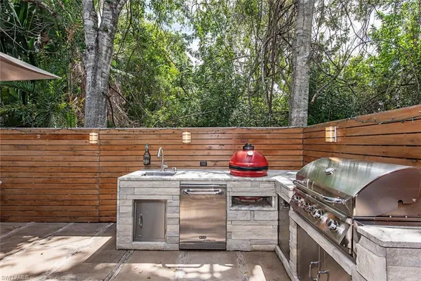 a kitchen with stainless steel appliances a stove and a oven