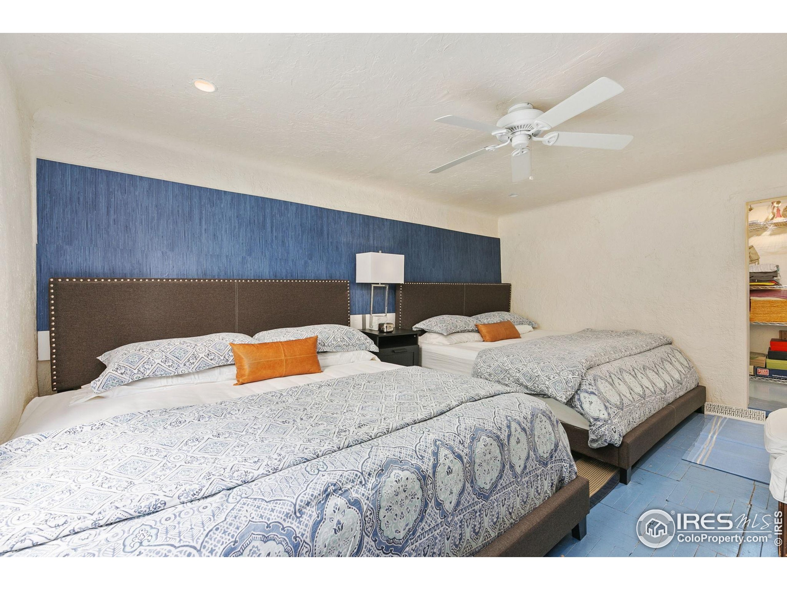 1304 West Prospect Road Fort Collins, CO 80526 - Photo 12 of 29 a bedroom with two beds and painting on the wall