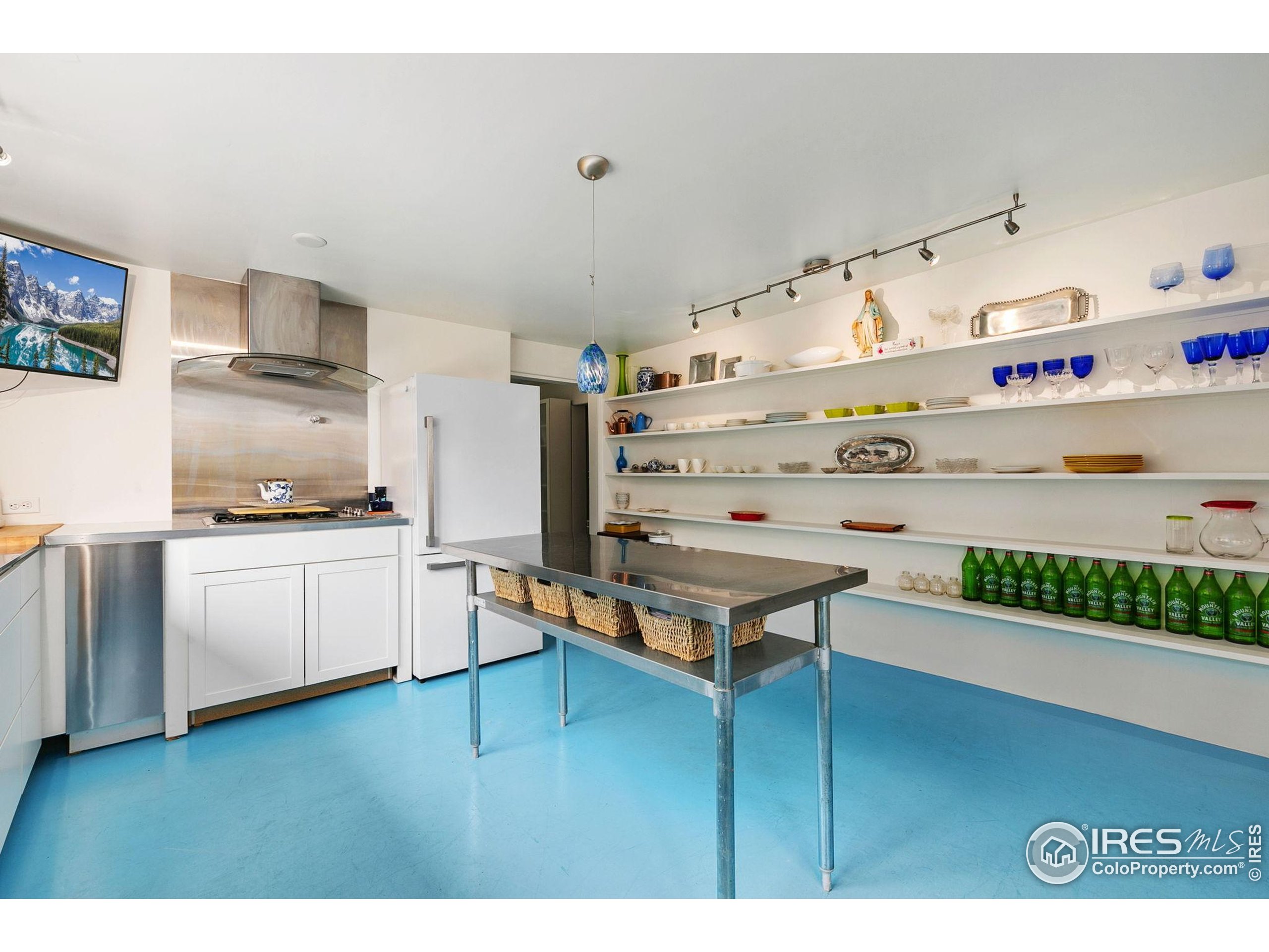 1304 West Prospect Road Fort Collins, CO 80526 - Photo 17 of 29 a kitchen with stainless steel appliances granite countertop a stove and cabinets