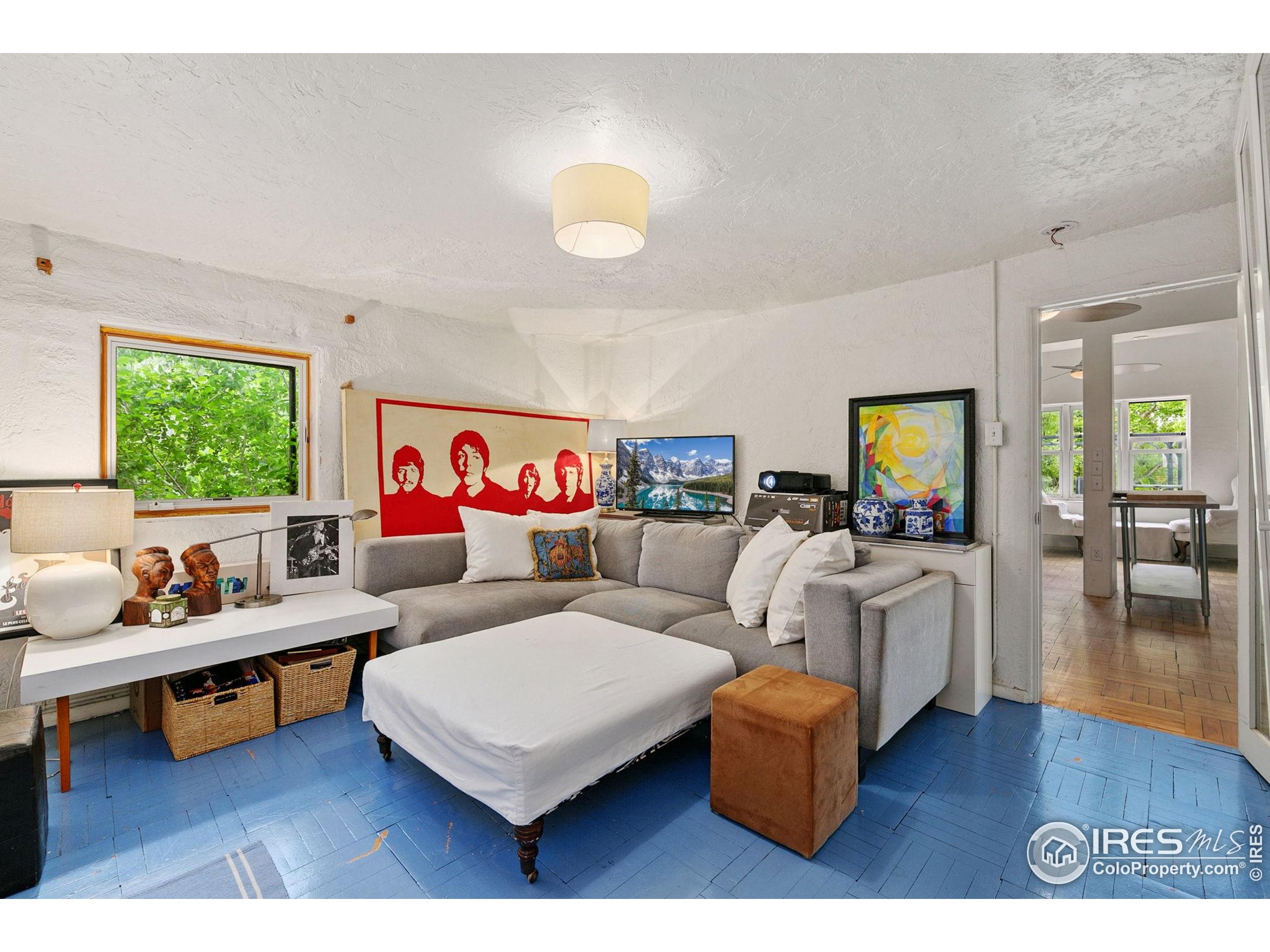 1304 West Prospect Road Fort Collins, CO 80526 - Photo 18 of 29 a living room with furniture and a wooden floor