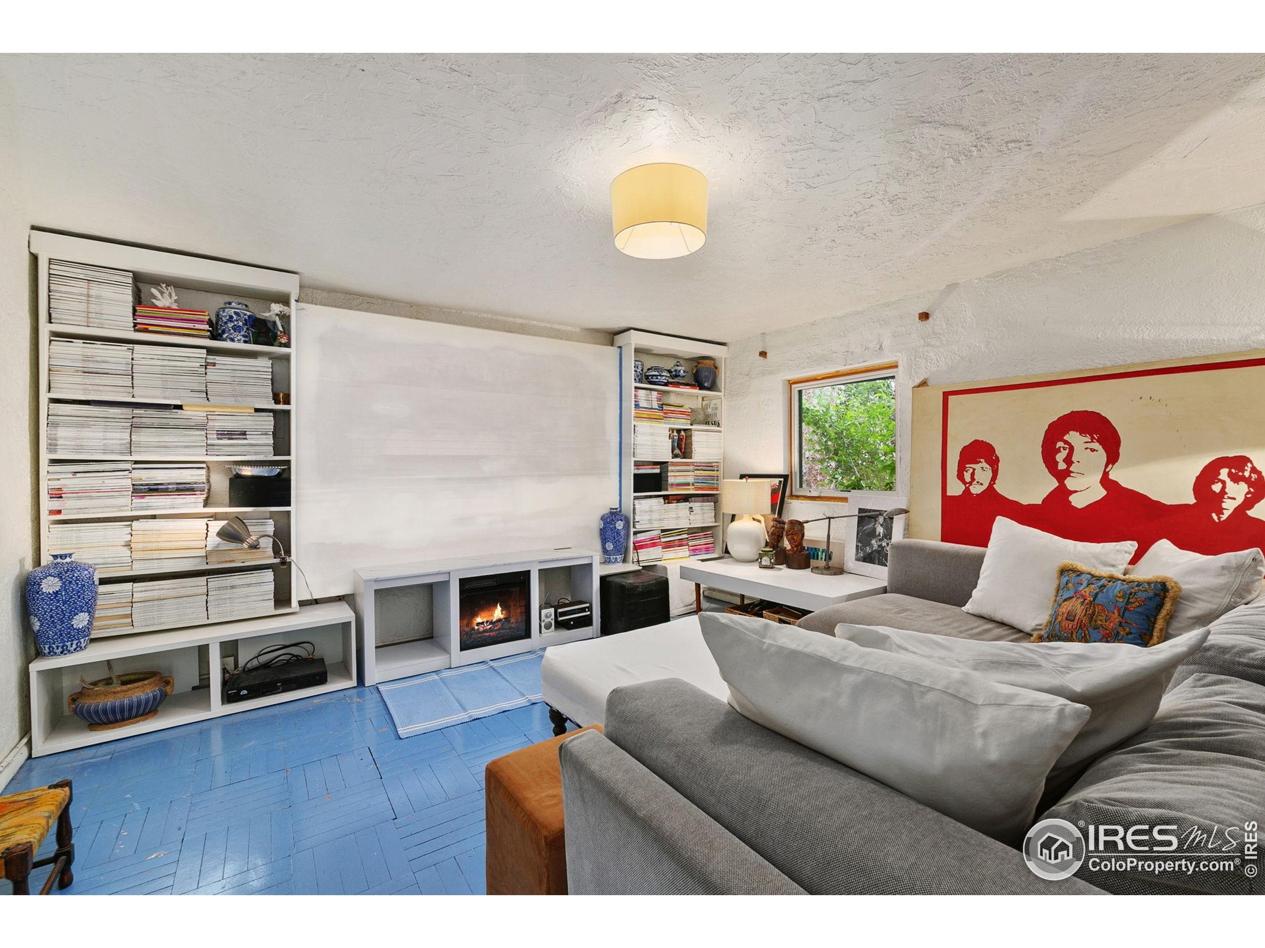 1304 West Prospect Road Fort Collins, CO 80526 - Photo 19 of 29 a living room with furniture and a flat screen tv