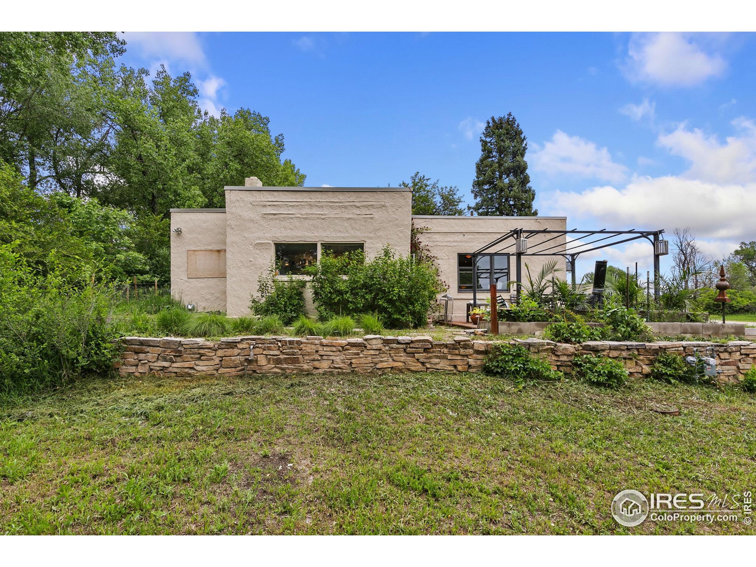 1304 West Prospect Road Fort Collins, CO 80526 - Photo 2 of 29 a front view of a house with a yard