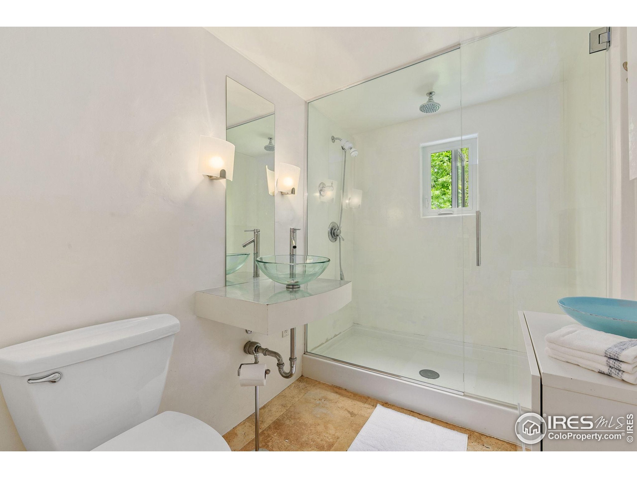 1304 West Prospect Road Fort Collins, CO 80526 - Photo 21 of 29 a bathroom with a shower a toilet and a sink