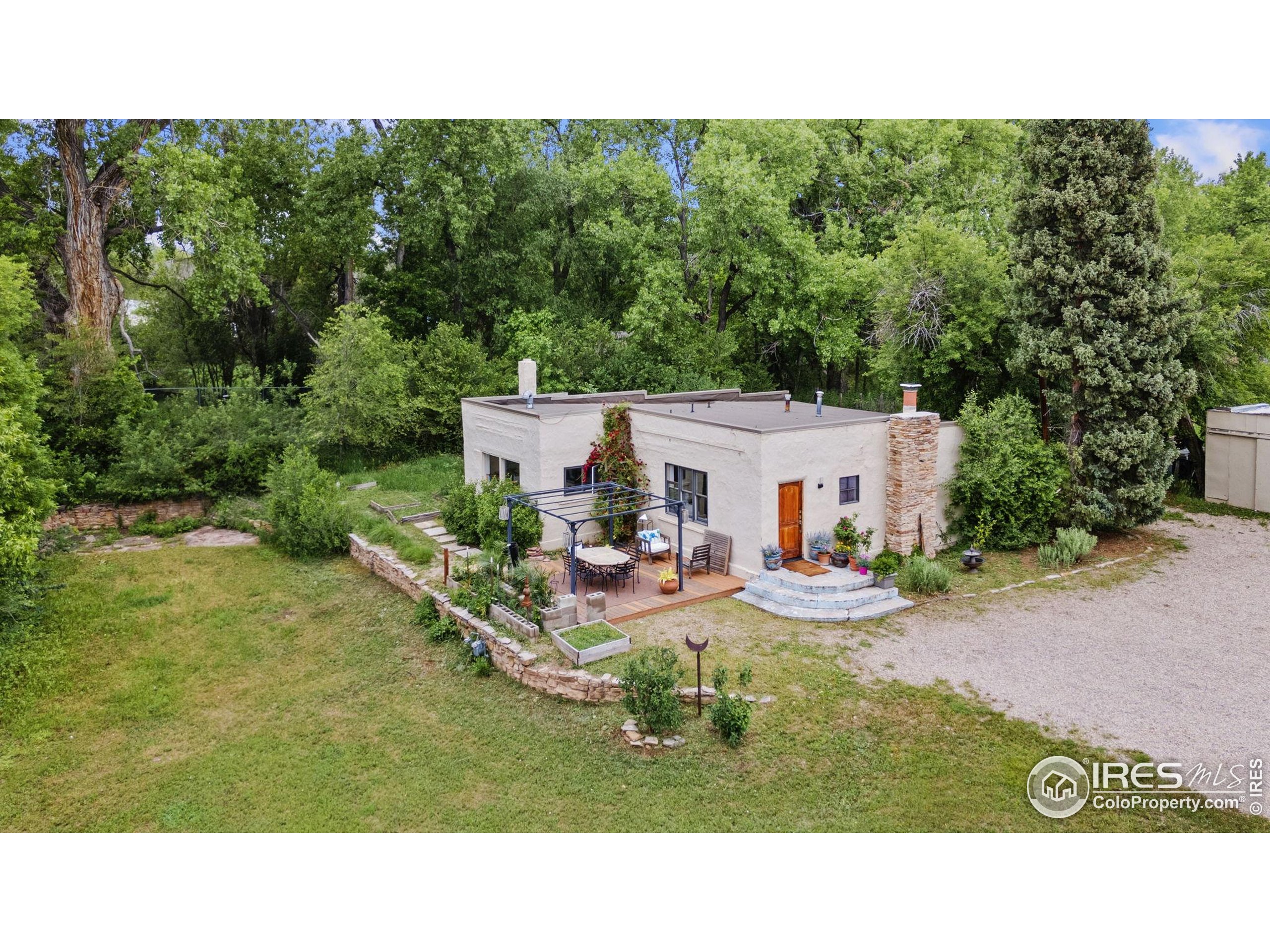 1304 West Prospect Road Fort Collins, CO 80526 - Photo 22 of 29 a view of a house with backyard and sitting area