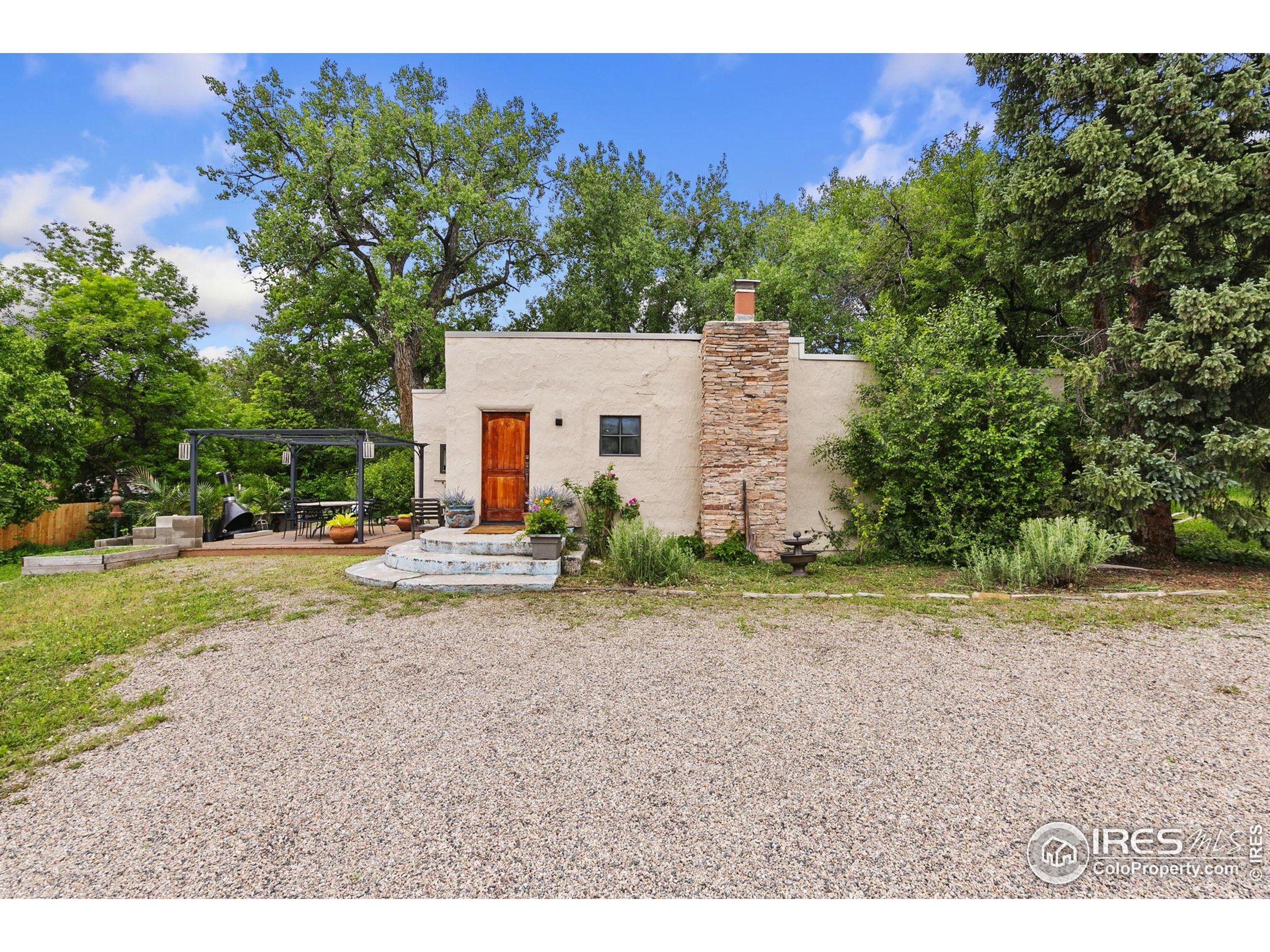 1304 West Prospect Road Fort Collins, CO 80526 - Photo 4 of 29 a view of a house with backyard and a tree