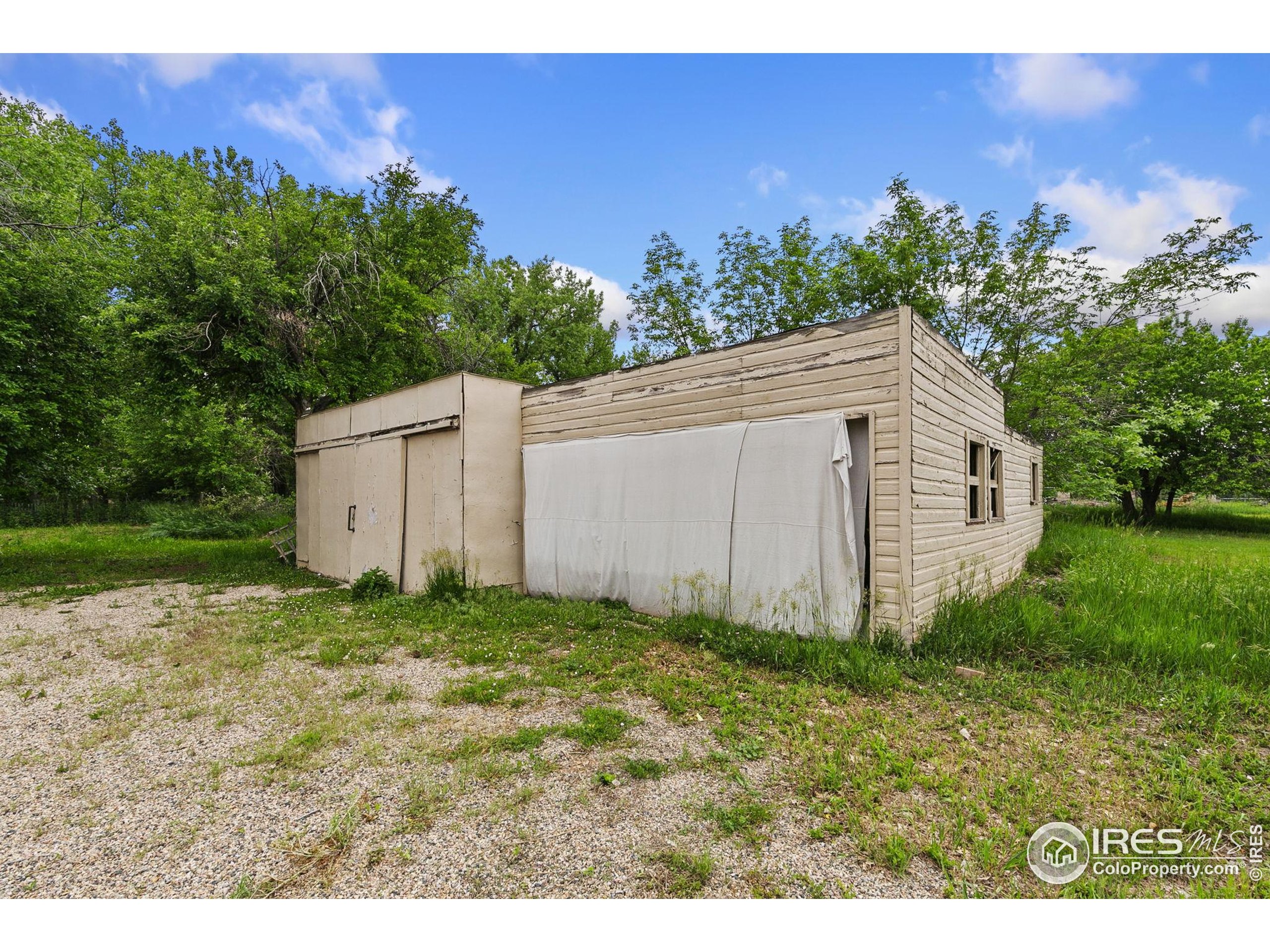1304 West Prospect Road Fort Collins, CO 80526 - Photo 7 of 29 a backyard of a house with lots of green space