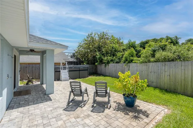 a view of a chairs and table in patio