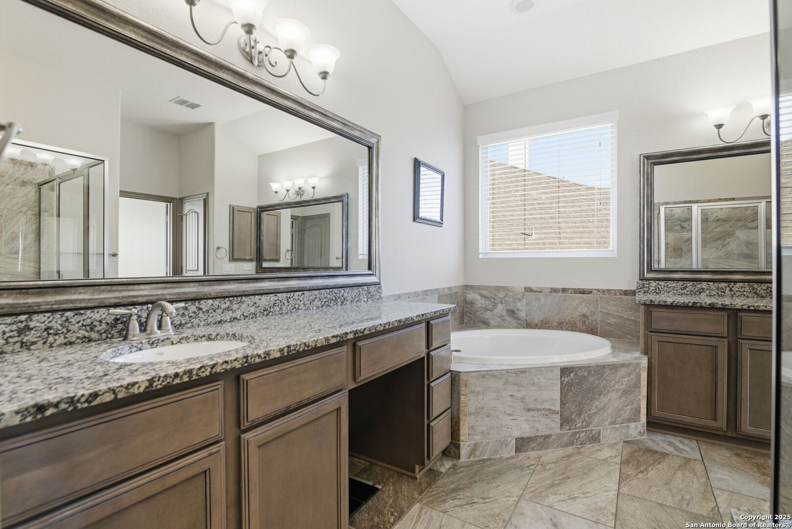 904 Turning Stone Cibolo, TX 78108 - Photo 16 of 35 a bathroom with a granite countertop sink and a mirror