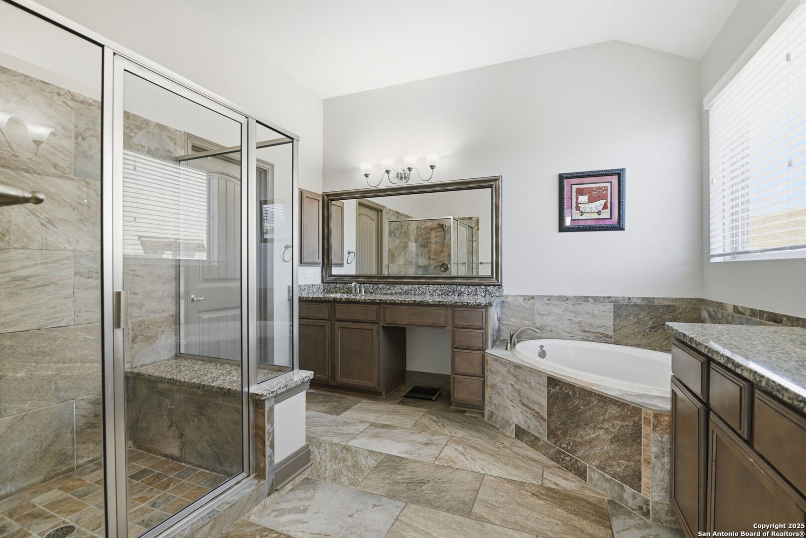 904 Turning Stone Cibolo, TX 78108 - Photo 17 of 35 a bathroom with a tub a sink and mirror