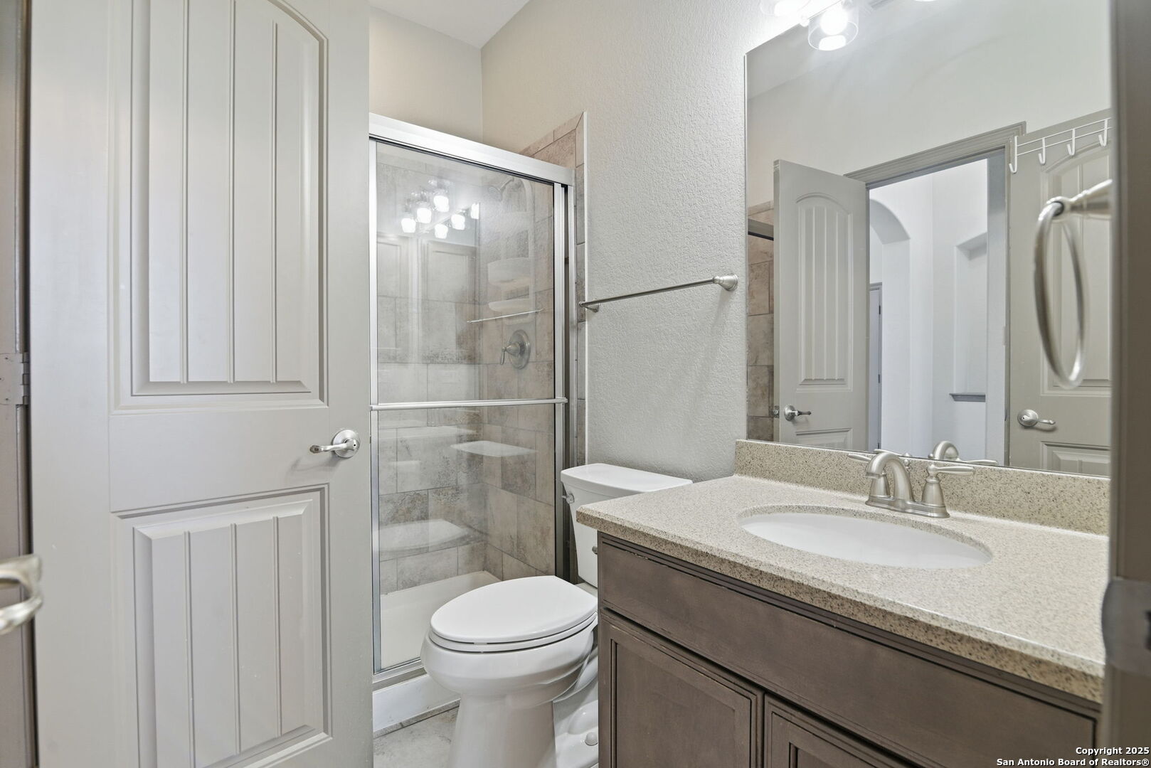 904 Turning Stone Cibolo, TX 78108 - Photo 22 of 35 a bathroom with a granite countertop sink toilet and shower