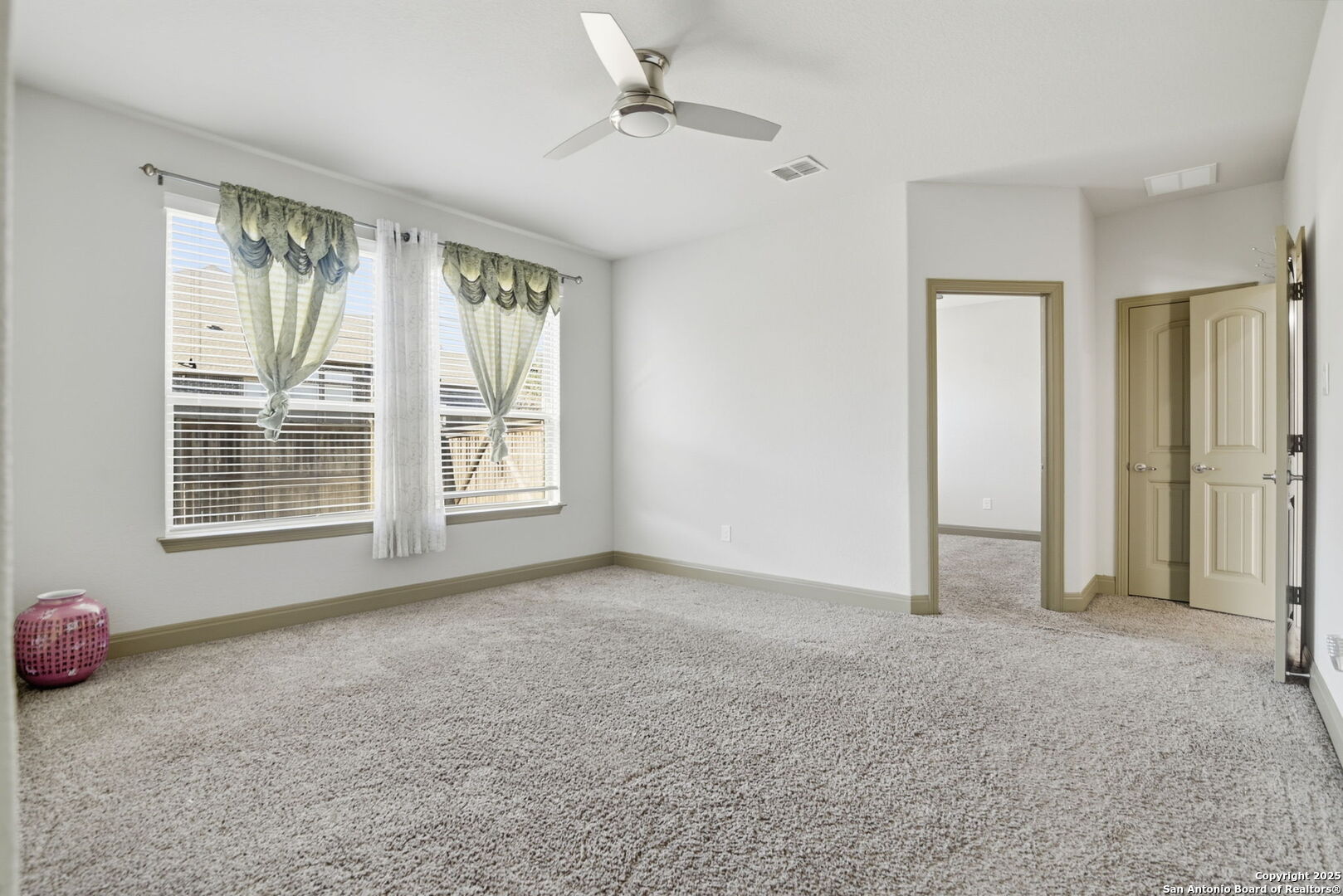 904 Turning Stone Cibolo, TX 78108 - Photo 26 of 35 an empty room with windows and closet