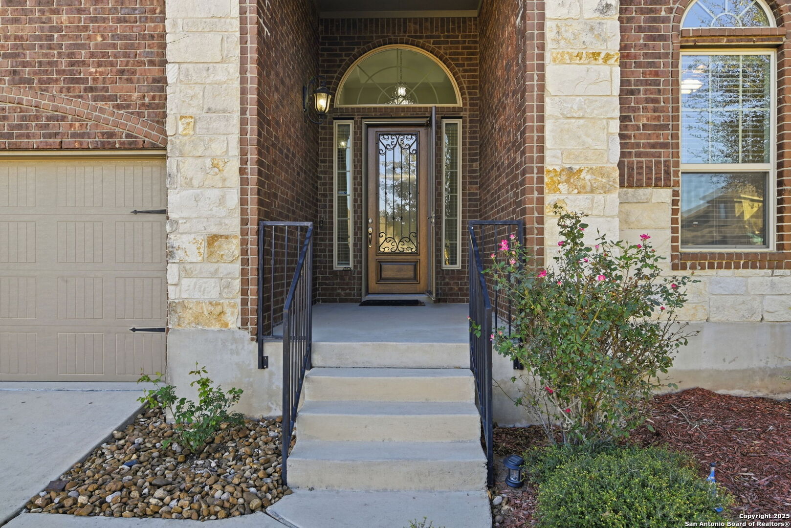 904 Turning Stone Cibolo, TX 78108 - Photo 3 of 35 a front view of a house with a garden