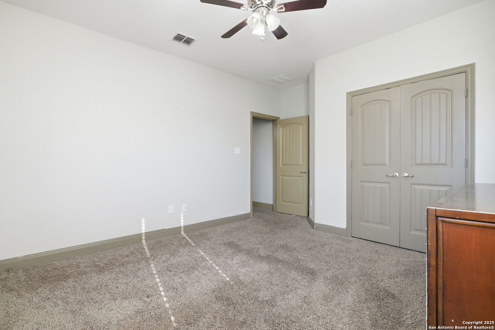 904 Turning Stone Cibolo, TX 78108 - Photo 32 of 35 an empty room with a ceiling fan