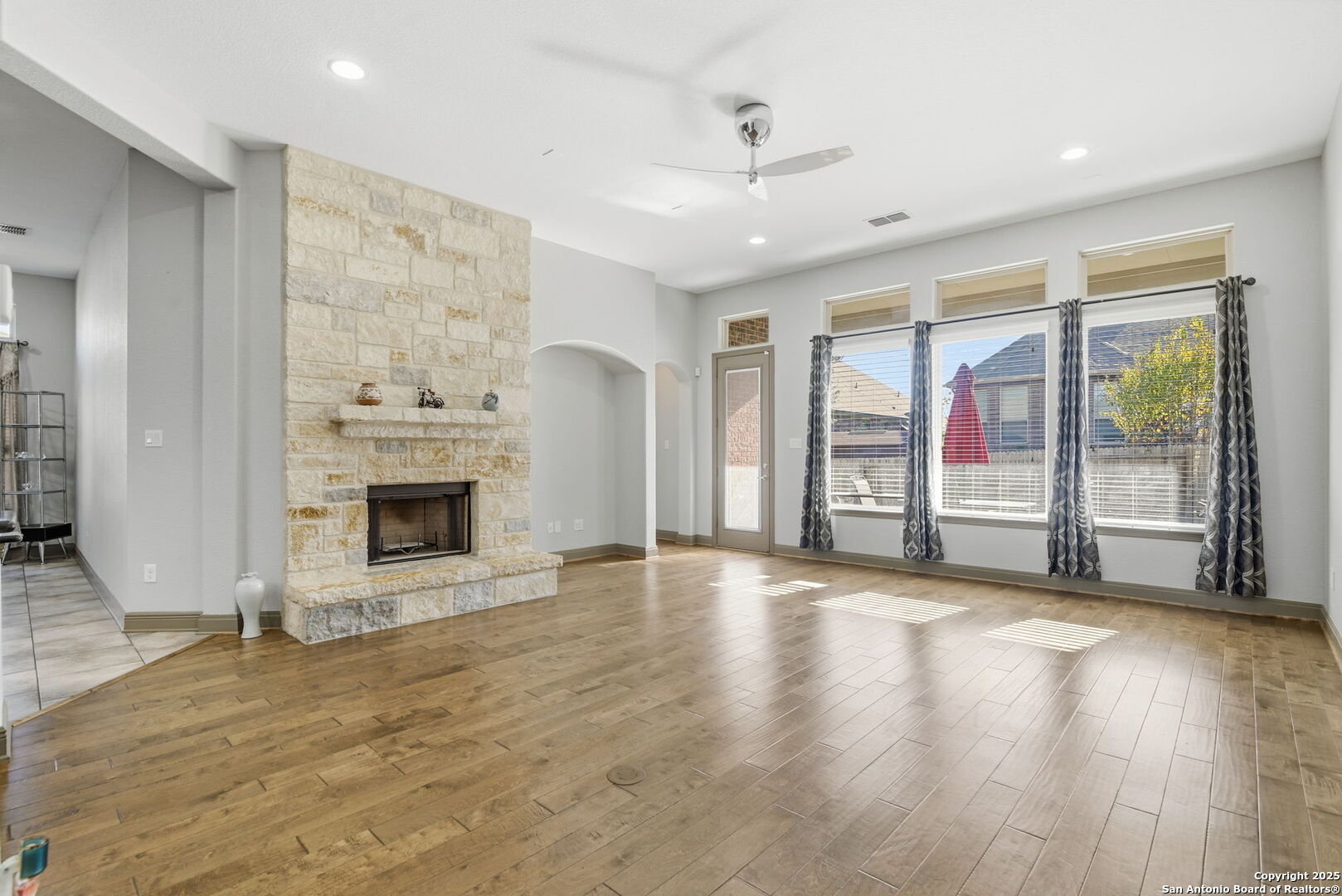 904 Turning Stone Cibolo, TX 78108 - Photo 6 of 35 a view of empty room with wooden floor and fireplace