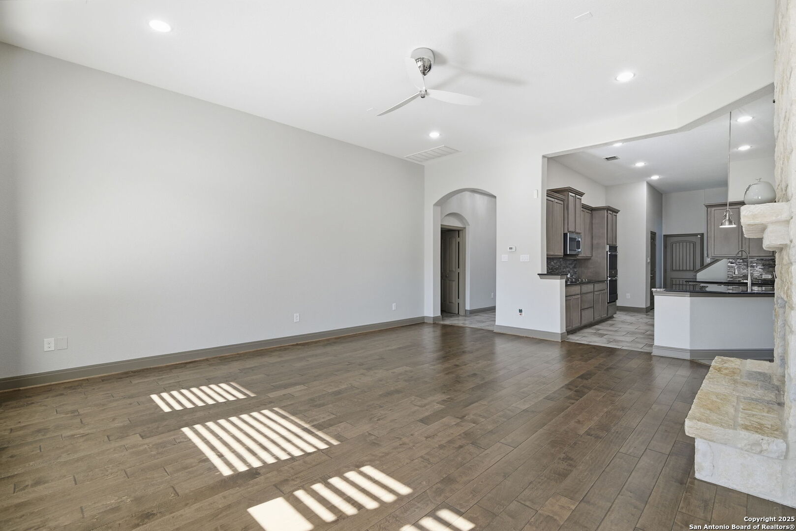 904 Turning Stone Cibolo, TX 78108 - Photo 7 of 35 a view of an empty room with kitchen and a window