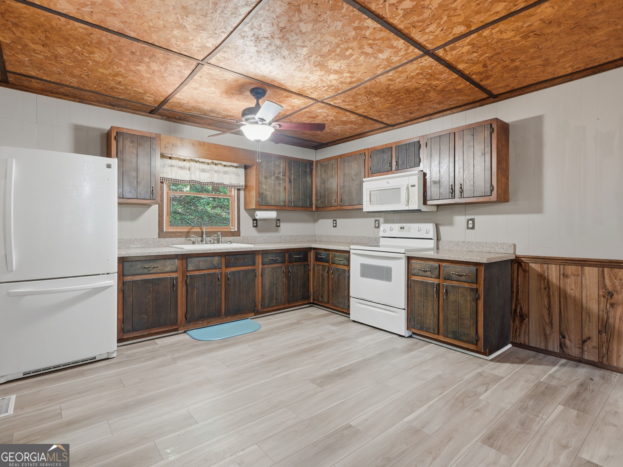 629 Goose Island Road Cherry Log, GA 30522 - Photo 7 of 52 a kitchen with stainless steel appliances granite countertop a stove sink and refrigerator