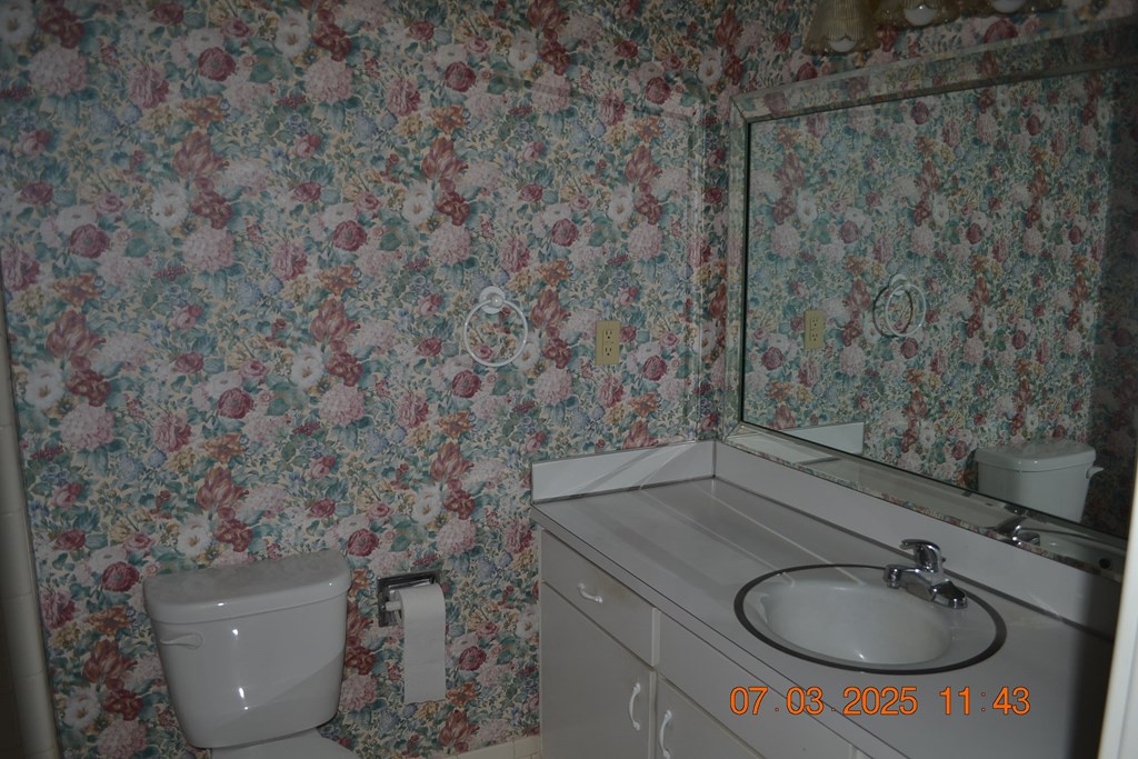 13642 Macon Road Upatoi, GA 31829 - Photo 15 of 34 a bathroom with a sink and a mirror