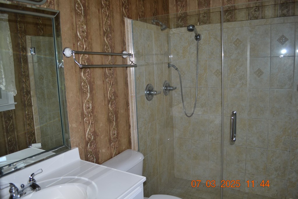 13642 Macon Road Upatoi, GA 31829 - Photo 16 of 34 a bathroom with a shower and a sink